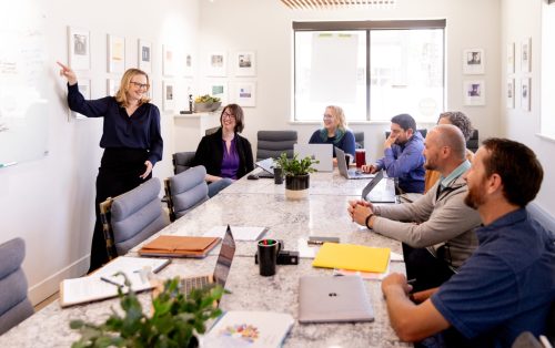 The Clarion Blue team collaborating during a strategy meeting